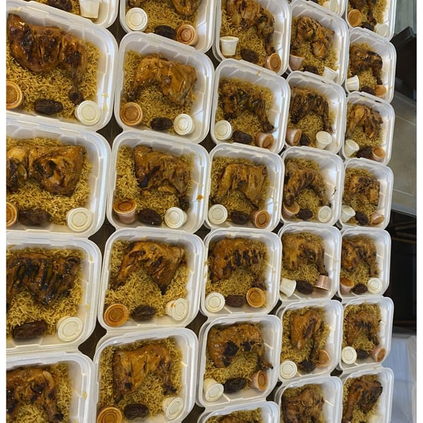 Rows of Port of Peri Peri chicken and rice meals in white takeout containers.
